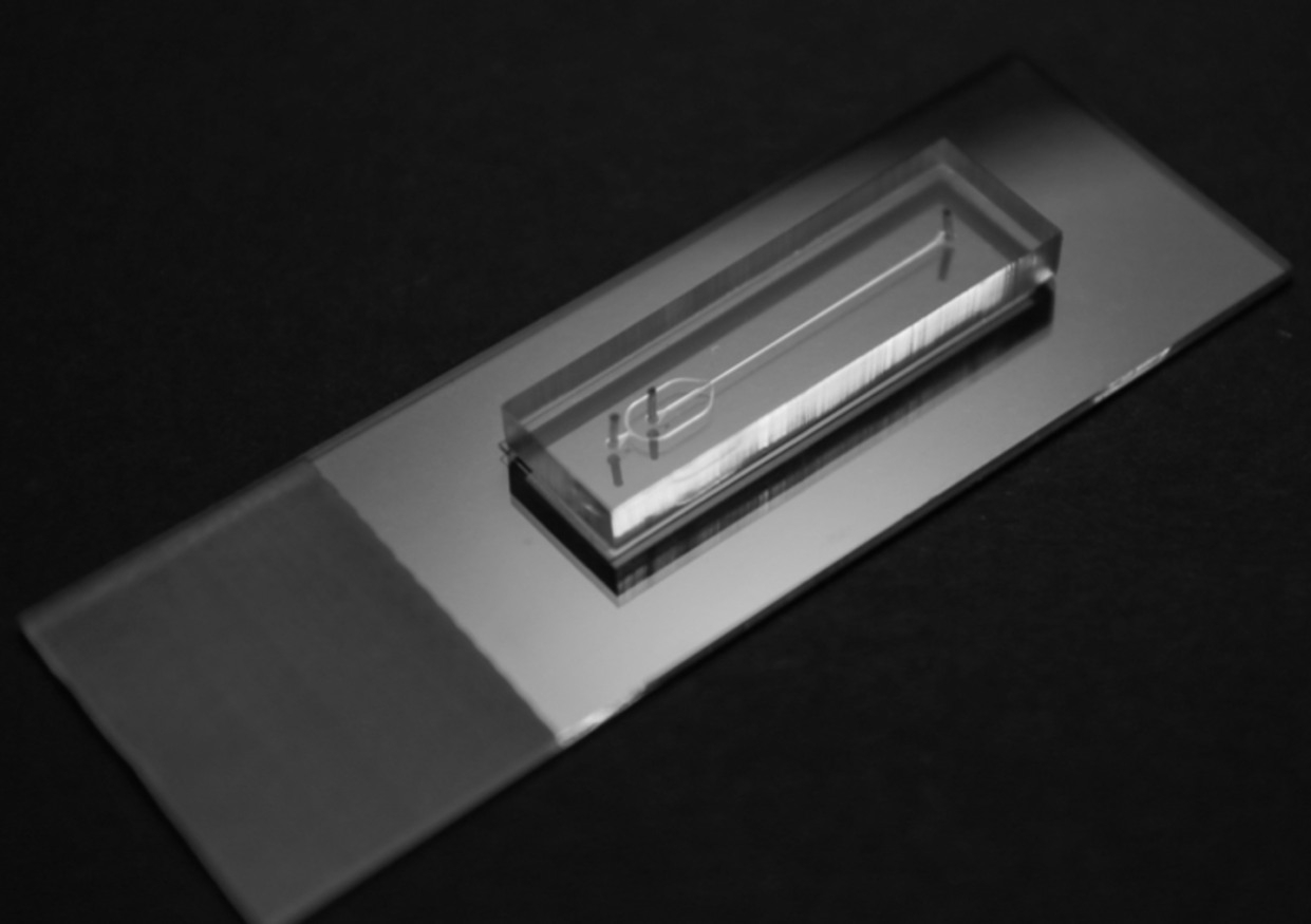 <span class="caption">The pipes imprinted on microfluidic chips are about the size of a human hair, and in many ways are like miniaturizing a chemical manufacturing plant.</span> <span class="attribution"><span class="source">(Katherine Elvira)</span>, <span class="license">Author provided</span></span>