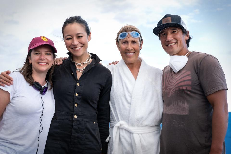 "NYAD" screenwriter/executive producer Julia Cox, who grew up on Cape Cod, (left to right), director Elizabeth Chai Vasarhelyi, Diana Nyad and director Jimmy Chin on the film set.