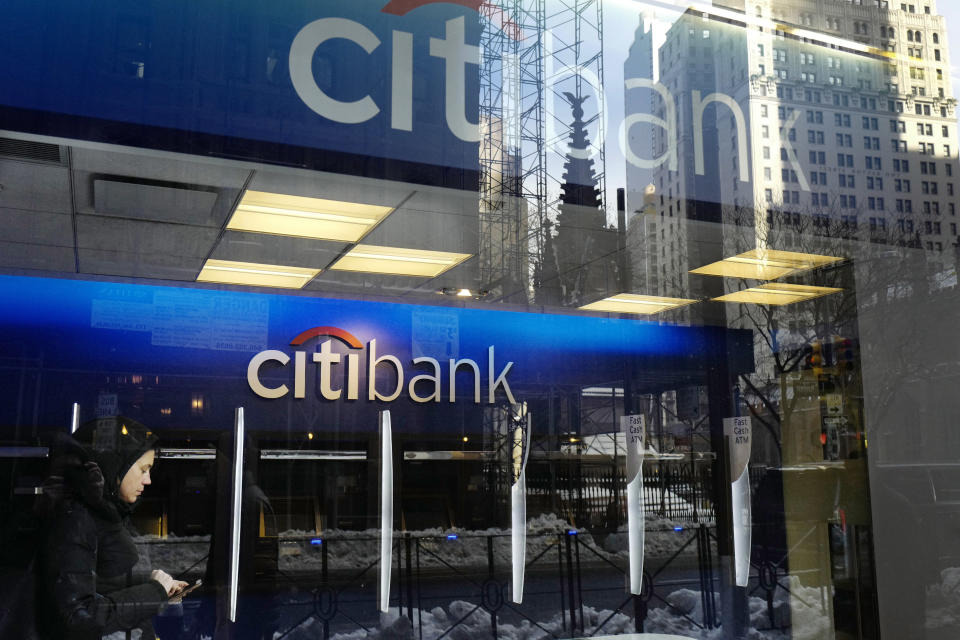 In this Thursday, March 16, 2017, photo, a customer enters a Citibank branch, in New York. On Thursday, April 13, 2017,  Citigroup reported a first quarter profit that beat analysts' expectations. Like its competitors, Citi benefited from higher trading revenue and interest rates. (AP Photo/Mark Lennihan)