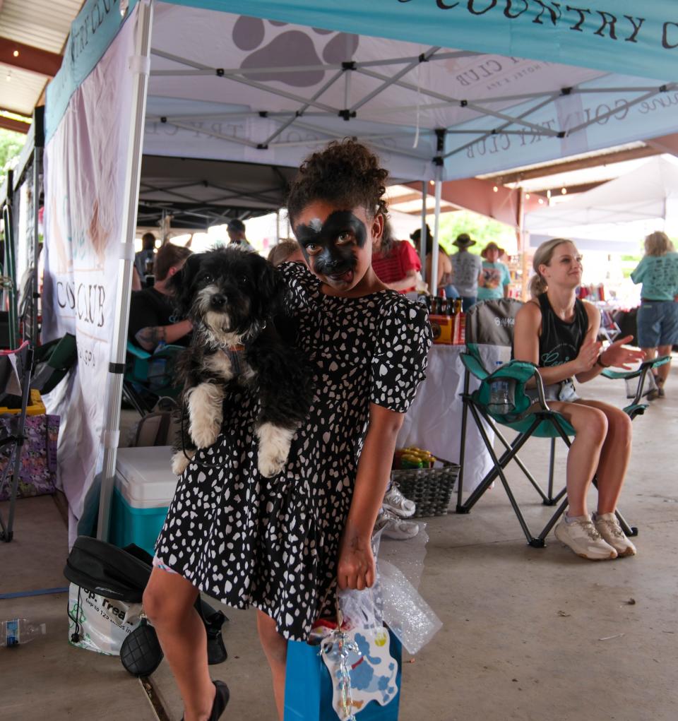 Ayla and her dog Drake won the pet lookalike contest Sunday at the 30th annual Muttfest at the Starlight Ranch in Amarillo.