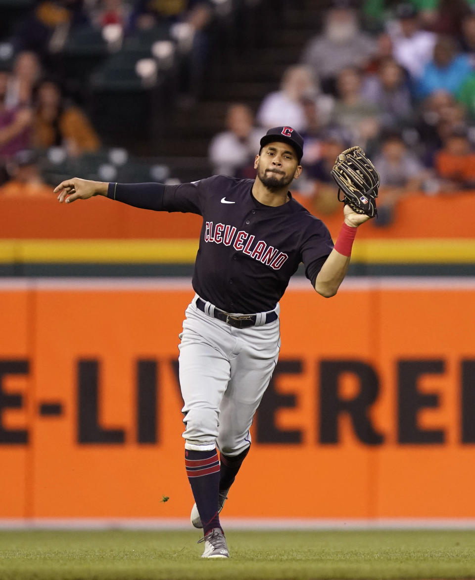 Cleveland Guardians left fielder Oscar Mercado catches a popup hit by Detroit Tigers' Jeimer Candelario with the bases loaded, ending the fourth inning of a baseball game Thursday, May 26, 2022, in Detroit. (AP Photo/Carlos Osorio)