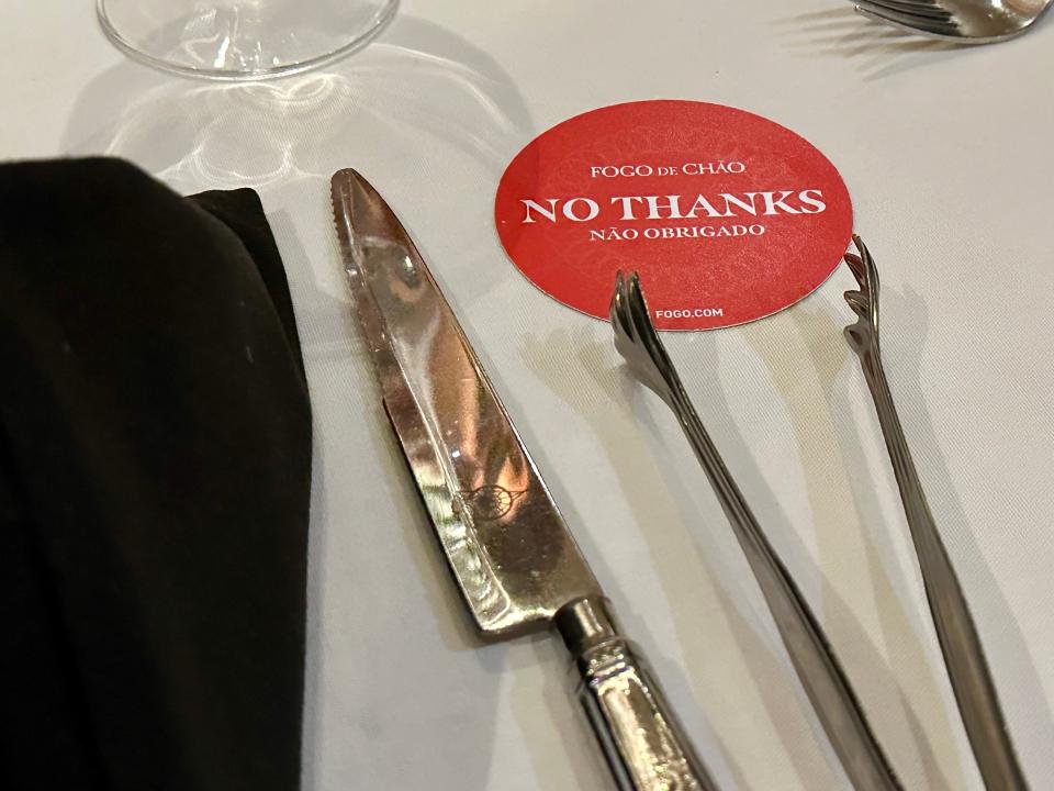 closeup shot of the silverware and "stop" card at fogo de chao steak house