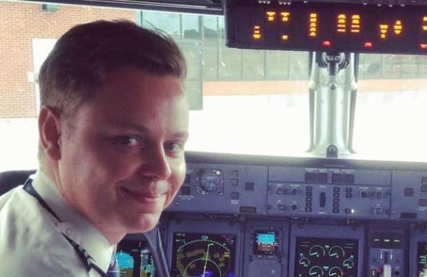 Sullivan, seen here in the cockpit before the pandemic grounded him and many others in the airline industry, said he hopes to get back in the air when travel opens up again.