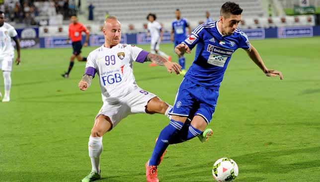 Miroslav Stoch closes down his opponent during the game against Al Nasr.