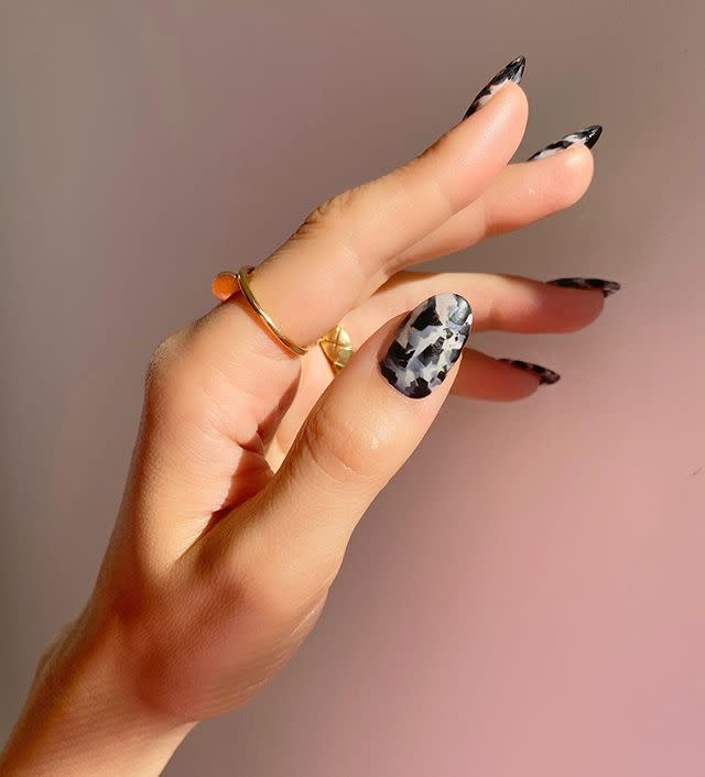 <a href="https://www.allure.com/story/tortoiseshell-manicure-nail-art-trend?mbid=synd_yahoo_rss" rel="nofollow noopener" target="_blank" data-ylk="slk:Tortoiseshell nails;elm:context_link;itc:0;sec:content-canvas" class="link ">Tortoiseshell nails</a> have been a thing for a while now, and there's no sign of the trend dying down, though we totally understand if you're ready for a new take on them this fall. Nail artist Betina Goldstein hand-painted <a href="https://www.instagram.com/p/CDys0AiDHkF/" rel="nofollow noopener" target="_blank" data-ylk="slk:these black-and-white beauties;elm:context_link;itc:0;sec:content-canvas" class="link ">these black-and-white beauties</a> using polishes by Essie, Chanel, and Orly — who says you have to stick to one brand? — atop <a href="https://apresnail.com/" rel="nofollow noopener" target="_blank" data-ylk="slk:Aprés Nail extensions;elm:context_link;itc:0;sec:content-canvas" class="link ">Aprés Nail extensions</a>. The more imperfect this look is the better, so it's ideal for a DIY attempt at nail art.