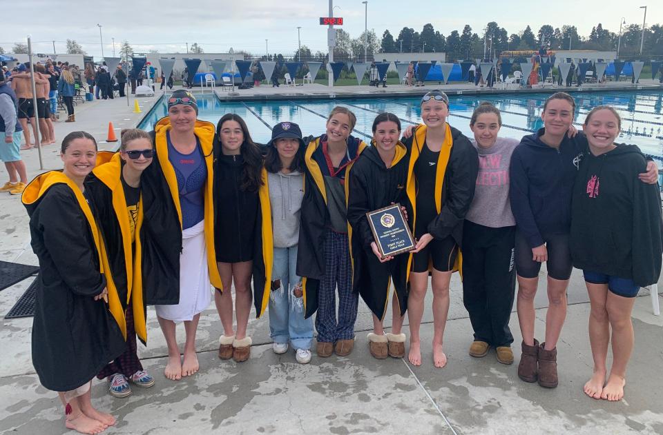 The Ventura High girls swimming team poses with the championship plaque after finishing first at the Ventura County Championships on Thursday at Buena High. From left to right: Emily Gonzalez, Juliet Lazowski, Hailey Armstrong, Lyla Shraeder, Val Lory, Celia Young, Lexi Zimpelman, Sarah Beckman, Heather Lory, Ella Montano, and Isabella Coleman.