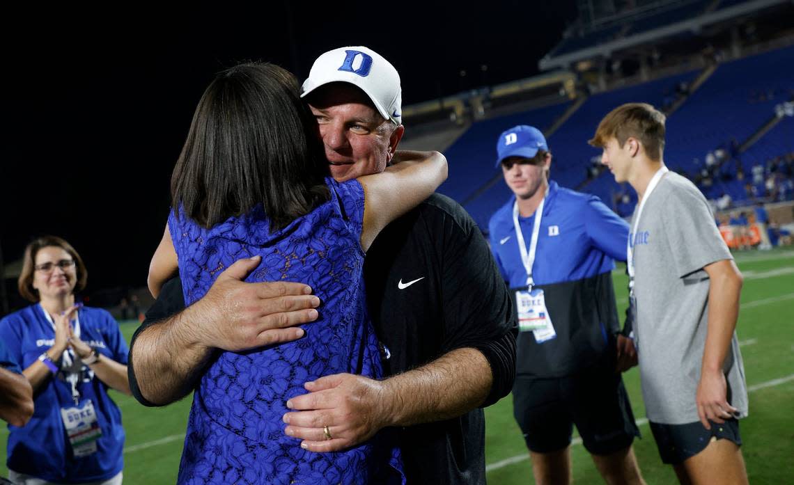 Duke head coach Mike Elko is congratulated by Duke Athletic Director Nina King following the Blue Devils 30-0 victory over Temple at Wallace Wade Stadium on Friday, Sept. 2, 2022, in Durham, N.C.