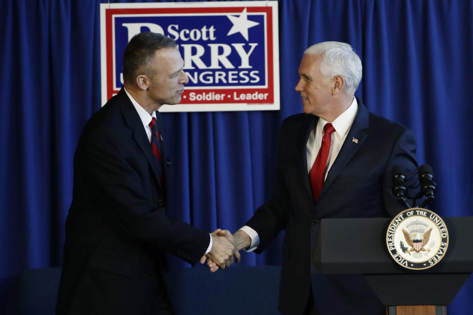 <span class="icon icon--xs icon__camera">  </span> <span class="credit font--s-m upper black"> <b>MATT ROURKE / AP</b> </span> <div class="caption space-half--right font--s-m gray--med db"> Vice President Mike Pence, right, shakes hands with U.S. Rep. Scott Perry, a Central Pennsylvania Republican, during at a campaign event in Lititz, Pa. on Oct. 24. </div>