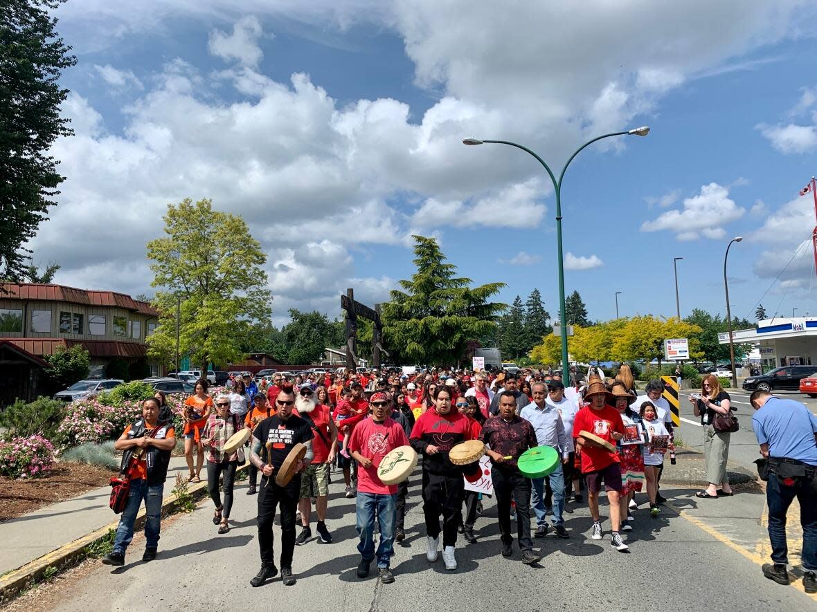 Hundreds of people from communities across Vancouver Island marched through the streets of Duncan, B.C. on Wednesday to honour Carsyn Seaweed, a 15-year-old member of Cowichan Tribes and Namgis First Nation who died on May 15, 2023.  (Kathryn Marlow/CBC - image credit)