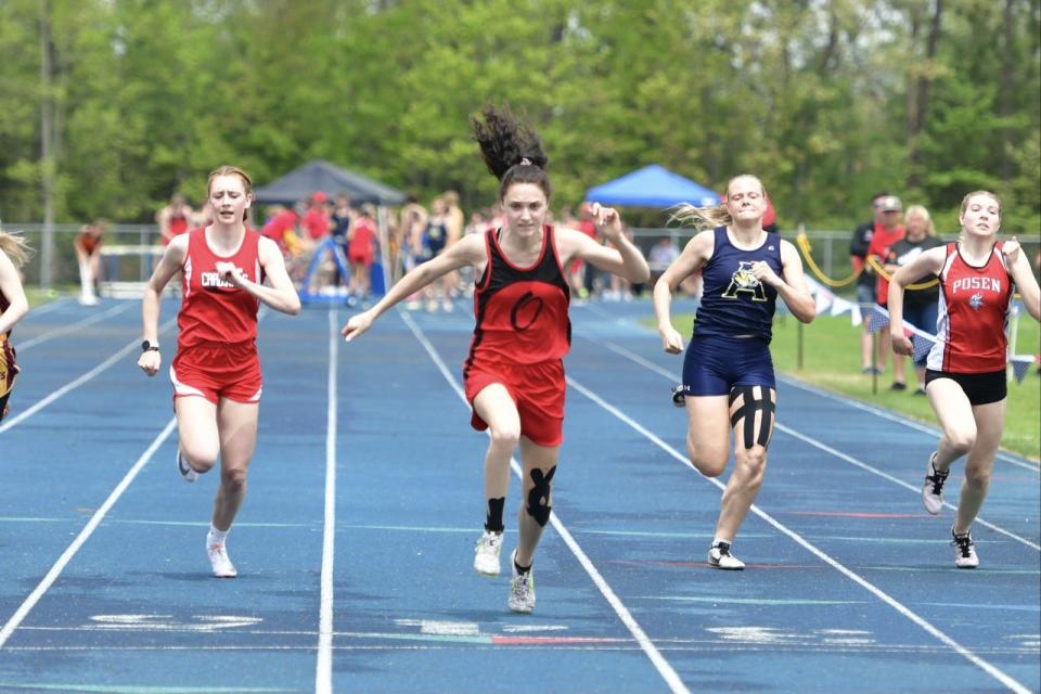 Onaway's Madilyn Crull finishes first in the girls 100 on Friday.