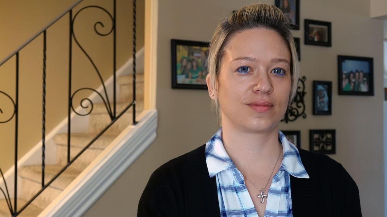 Sabrina L'Heureux is shown at her home on Friday, two days after her ex-partner, Paul John MacDonald, was sentenced for attacking her twice and subjecting her to a year's worth of harassment. She says the amount of time he'll spend behind bars is 'so frustrating.'  (Dan Taekema/CBC - image credit)