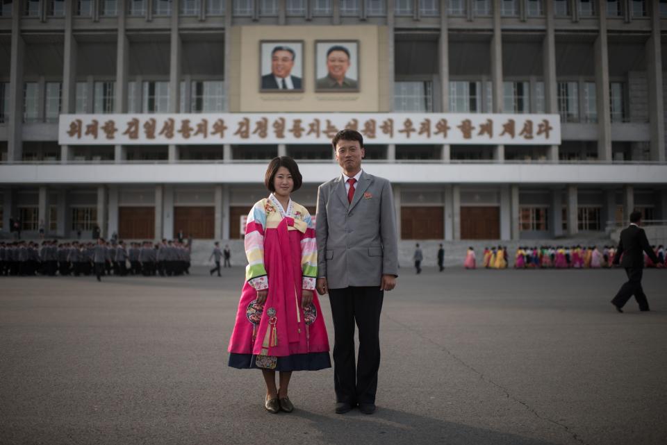 Students Jo Jong-Im, 19, (left) and Jo Kwang-Hyok 31, pose for a portrait following a mass dance event in central Pyongyang.