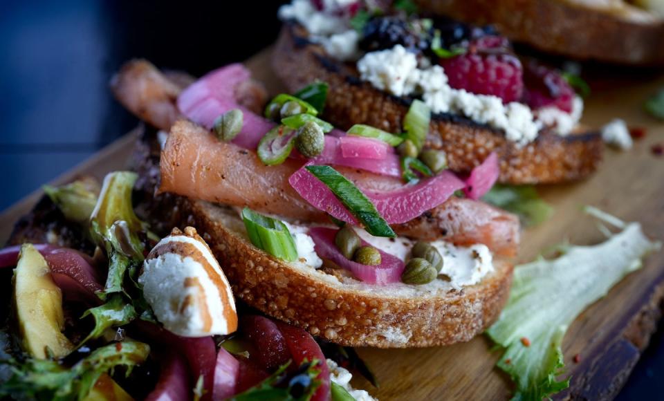 The Toast Tasting board at Downtown Tilly. Featured front to back are Avocado toast, Lox toast and  Monkey Toast, and Berry Breakfast toast.