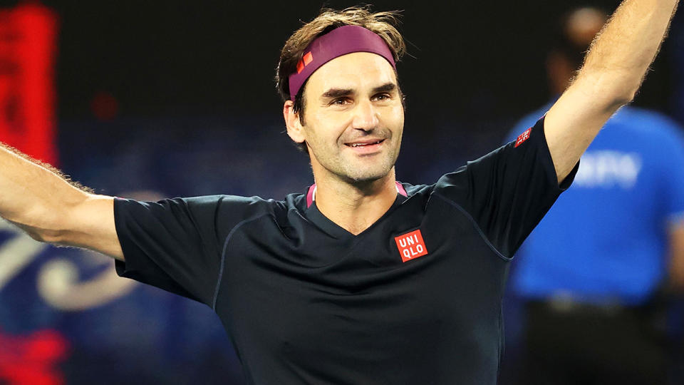 Roger Federer is pictured celebrating his Australian Open win over Australia's John Millman.