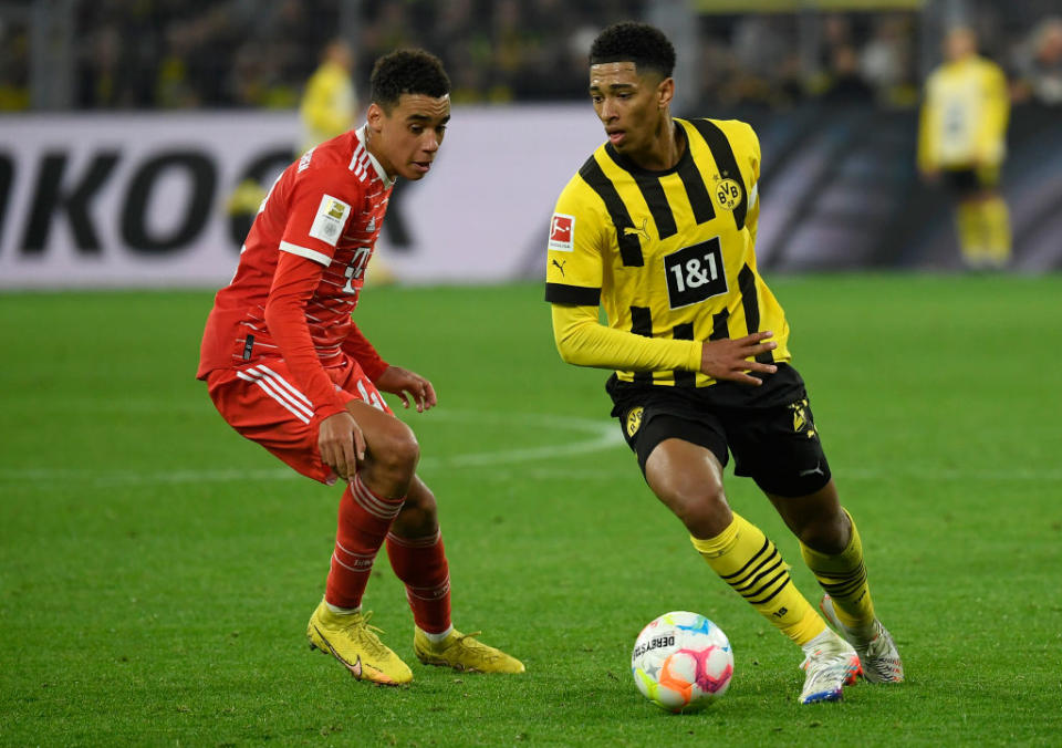 Jamal Musiala of Bayern Munich and Jude Bellingham of Borussia Dortmund battle for the ball during the Bundesliga match between Borussia Dortmund and FC Bayern München at Signal Iduna Park on October 8, 2022 in Dortmund, Germany.