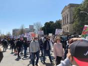 Hundreds of people gather in a park across from the Georgia state Capitol in Atlanta to demand justice for the victims of shootings at massage businesses days earlier, Saturday, March 20, 2021 in Atlanta. (AP Photo/Candice Choi)