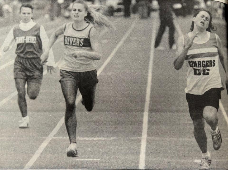 Sara Deckert (right) helped Doland-Conde's girls win the state B championship during the 1993 South Dakota State High School Track and Field Championships by winning the 400-meter dash over Nicole Jensen of Lake Preston and Annie Rademacher of Grant-Deuel.