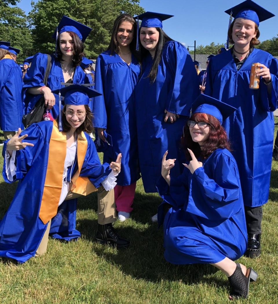 A group of graduates gathers moments before Kennebunk High School's commencement ceremony on Sunday, June 5, 2022. Standing are Kit Naber, left, Lily Isaac, Juliauna Tadlock, and Serenity Davis. Kneeling are Emilie Santerre, left, and Emily Condon.