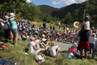 Spectators cheer the riders as they climb Colmiane pass during the second stage of the Tour de France cycling race over 186 kilometers (115,6 miles) with start and finish in Nice, southern France, Sunday, Aug. 30, 2020. (AP Photo/Thibault Camus)