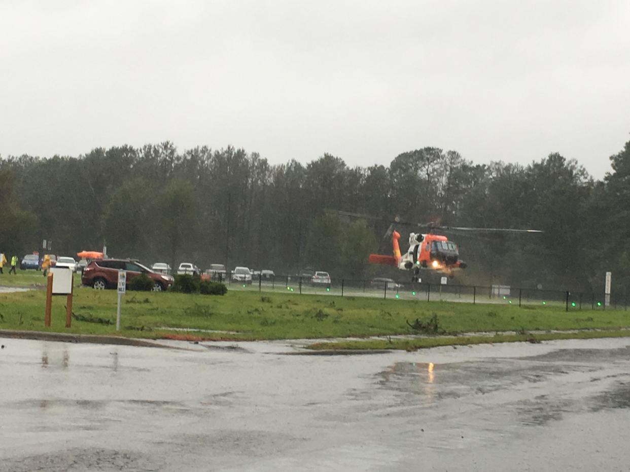 A Coast Guard helicopter lands at Onslow Memorial Hospital during Hurricane Florence.