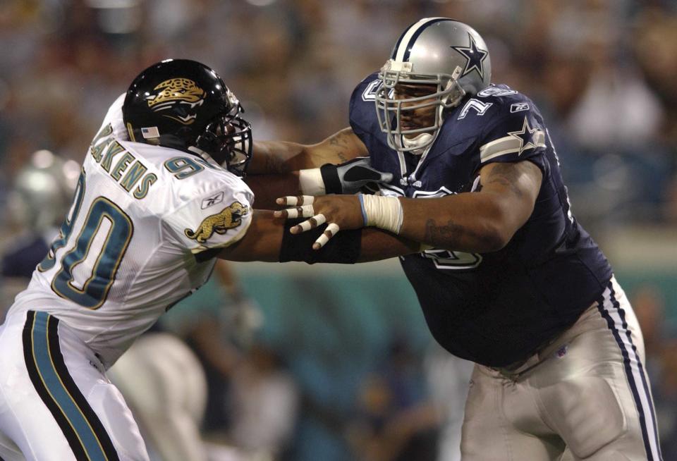 Char-ron Dorsey (79), playing for the Dallas Cowboys, blocks Jaguars defensive end Tony Brackens in a 2002 game.