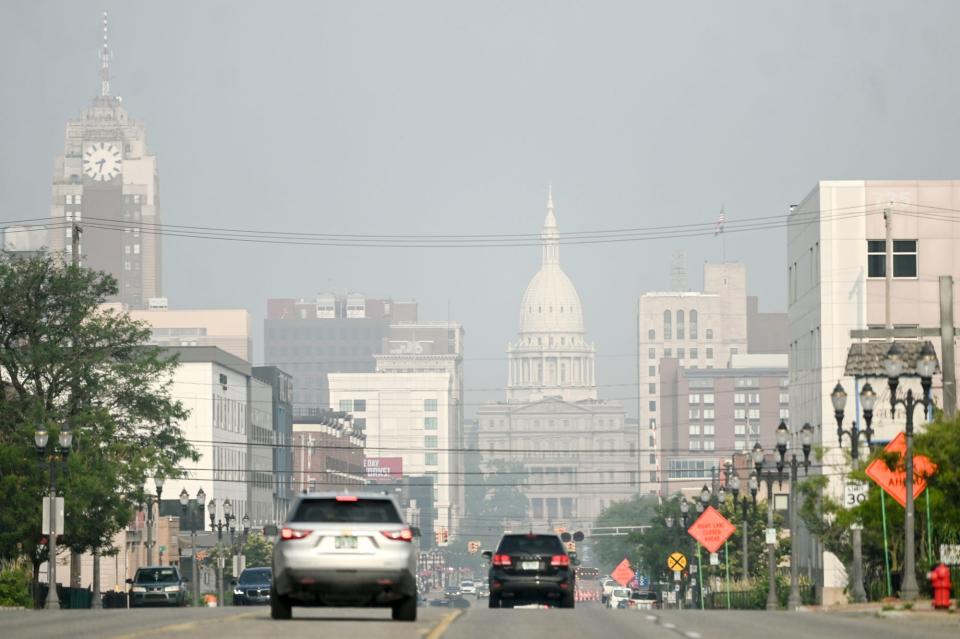 The Michigan Capitol seen though the haze on Wednesday, June 28, 2023, in downtown Lansing.