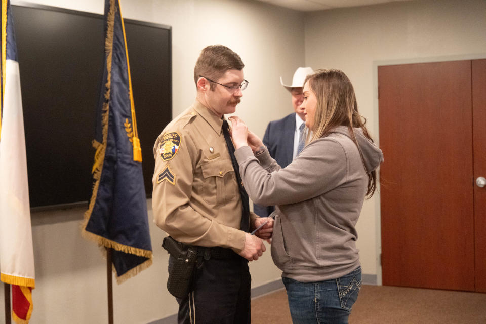 Randall County Sheriff Christopher Forbis presents Officer Vicki Nirschl with a service award Thursday at the Randall County Sheriff's Office outside of Amarillo.