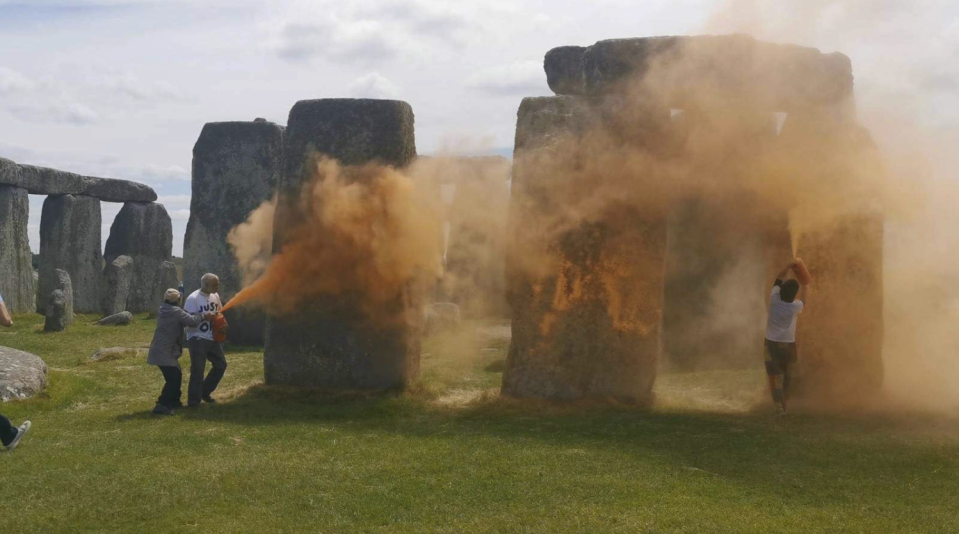 Just Stop Oil climate activists spray Stonehenge in the UK with an orange substance to protest against fossil fuels on June 19, 2024. / Credit: Just Stop Oil