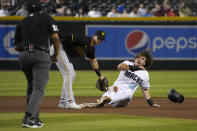 Arizona Diamondbacks' Jake McCarthy (30) looks to umpire Erich Bacchus after stealing second base under the tag by Pittsburgh Pirates second baseman Kevin Newman during the third inning of a baseball game Tuesday, Aug. 9, 2022, in Phoenix. (AP Photo/Rick Scuteri)