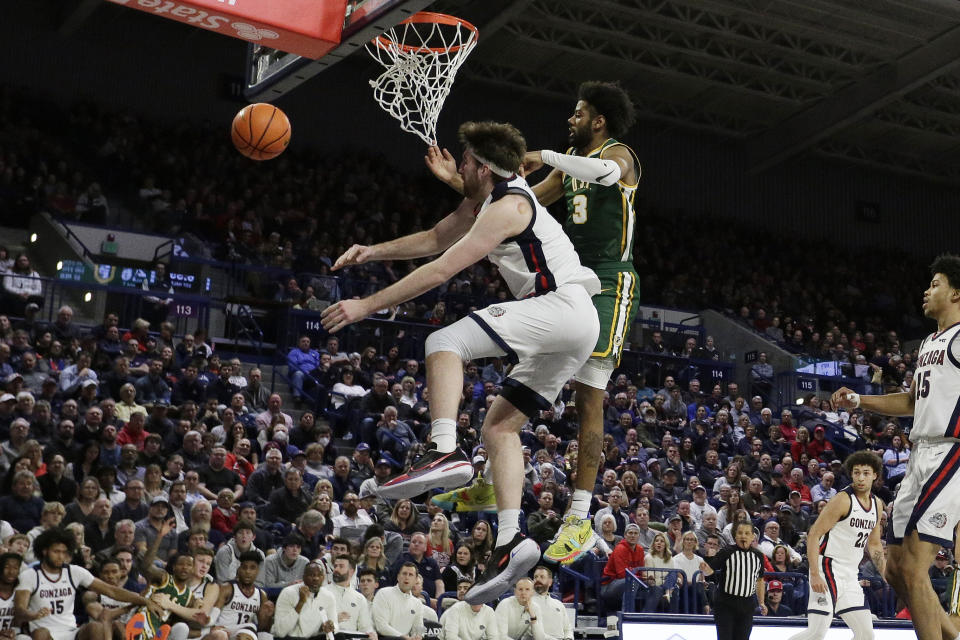 Gonzaga forward Drew Timme, left, and San Francisco forward Isaiah Hawthorne go after a rebound during the first half of an NCAA college basketball game, Thursday, Feb. 9, 2023, in Spokane, Wash. (AP Photo/Young Kwak)