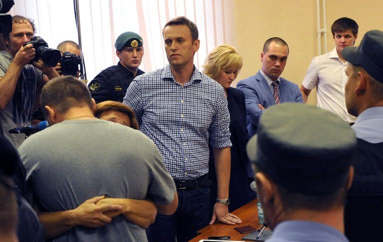 Top Russian protest leader Alexei Navalny stands in the courtroom in Kirov, northern Russia during his sentencing for embezzlement on July 18, 2013. The court on Thursday sentenced Navalny to five years in a penal colony after finding him guilty of embezzlement, a verdict which will disqualify one of President Vladimir Putin's fiercest critics from politics