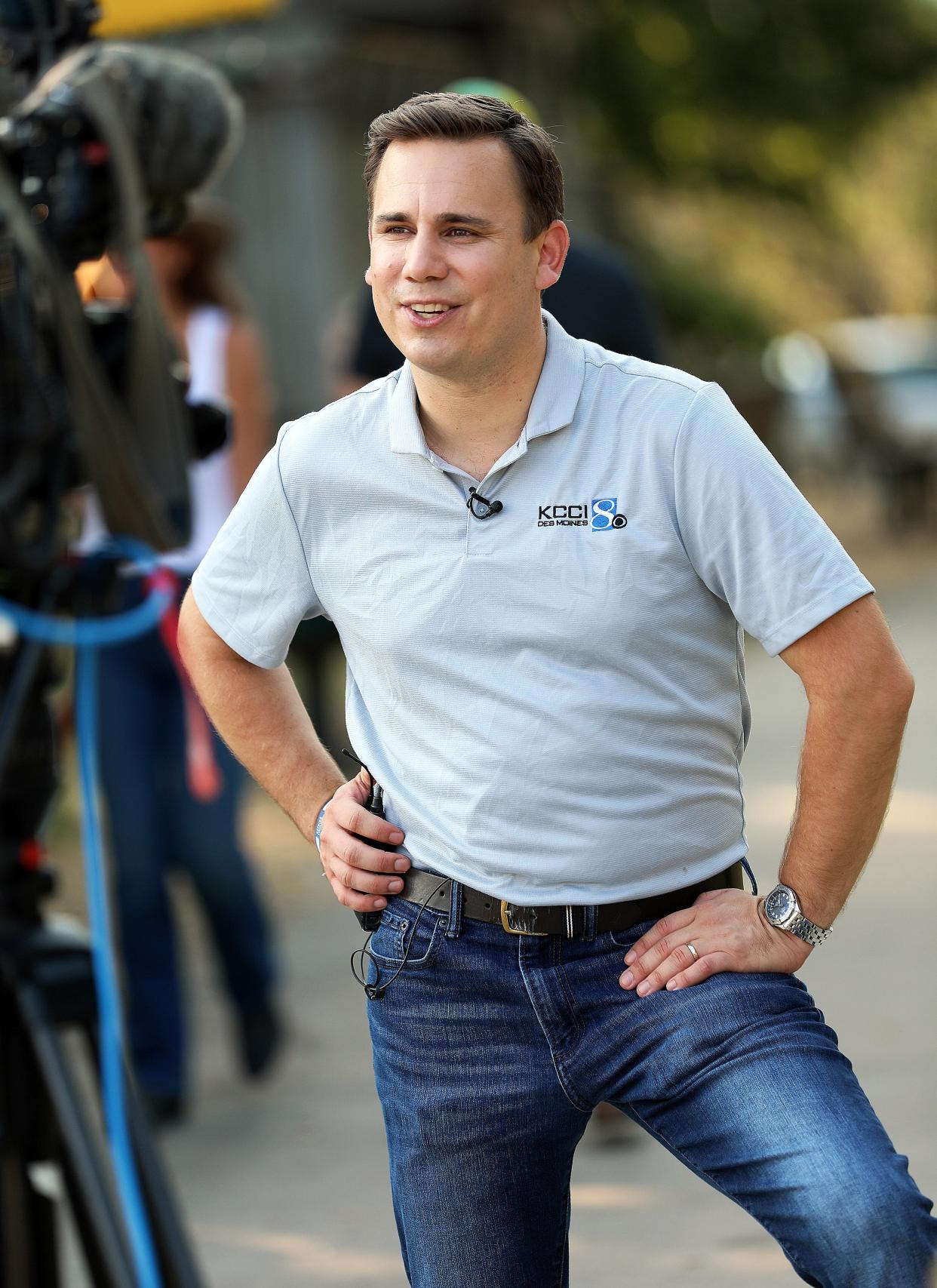 KCCI chief meteorologist Chris Gloninger delivers the weather forecast during a live remote broadcast at the Iowa State Fair in Des Moines.