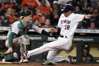 Houston Astros' Jason Castro (18) is tagged out at home by Oakland Athletics catcher Sean Murphy during the sixth inning of a baseball game, Saturday, Oct. 2, 2021, in Houston. (AP Photo/Eric Christian Smith)