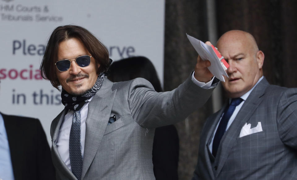 Actor Johnny Depp arrives at the High Court in London, Thursday, July 16, 2020. Depp is suing News Group Newspapers, publisher of The Sun, and the paper’s executive editor, Dan Wootton, over an April 2018 article that called him a “wife-beater.” The Sun’s defense relies on a total of 14 allegations by his ex-wife Amber Heard of Depp’s violence. He strongly denies all of them. (AP Photo/Alastair Grant)