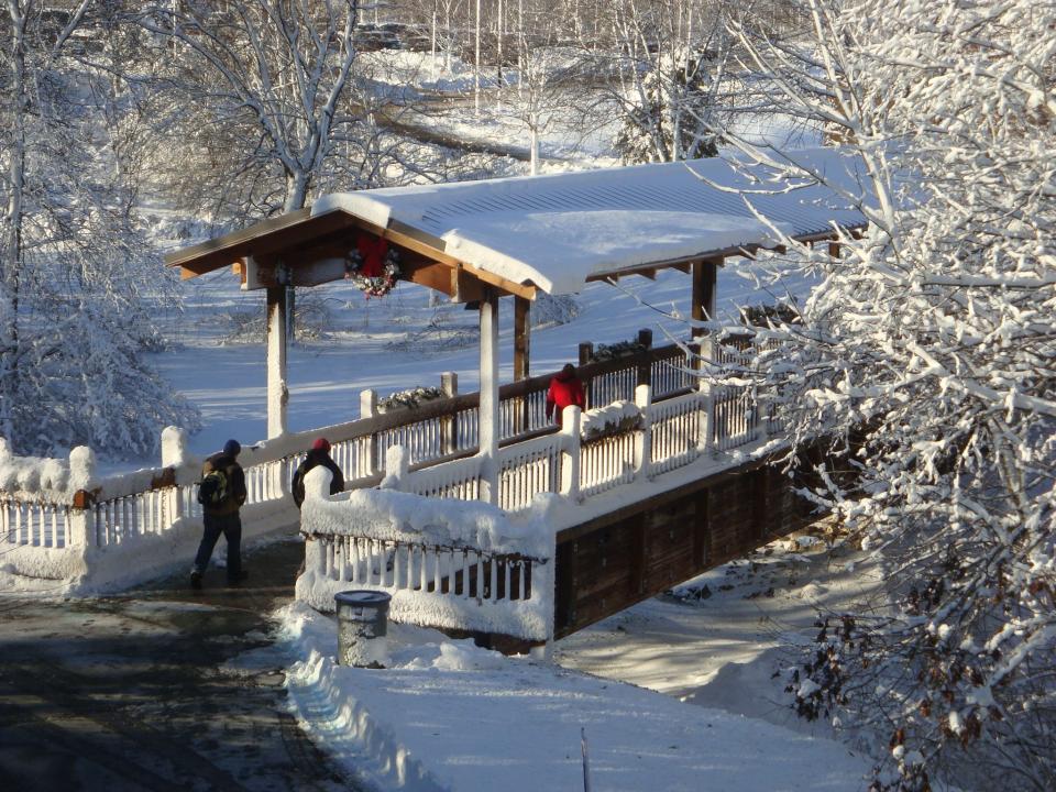 Students cross a bridge on campus at Lakeshore Technical College in Cleveland.