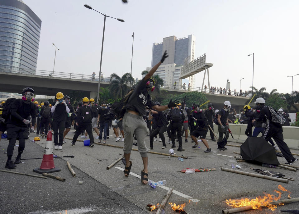 Demonstrators clash with police during a protest in Hong Kong, Saturday, Aug. 24, 2019. Chinese police said Saturday they released an employee at the British Consulate in Hong Kong as the city's pro-democracy protesters took to the streets again, this time to call for the removal of "smart lampposts" that raised fears of stepped-up surveillance. (AP Photo/Vincent Yu)