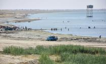 Iraqis swim in Lake Habbaniyah, Anbar province, about 85 kilometres west of the capital Baghdad, on August 22, 2018