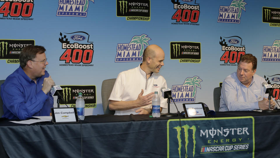 Manufacturers representatives, from left , Jim Campbell for Chevrolet, Mark Rushbrook for Ford, and Ed Laukes for Toyota, talk to the media during a press conference before practice for a NASCAR Cup Series auto race on Saturday, Nov. 16, 2019, at Homestead-Miami Speedway in Homestead, Fla. (AP Photo/Terry Renna)