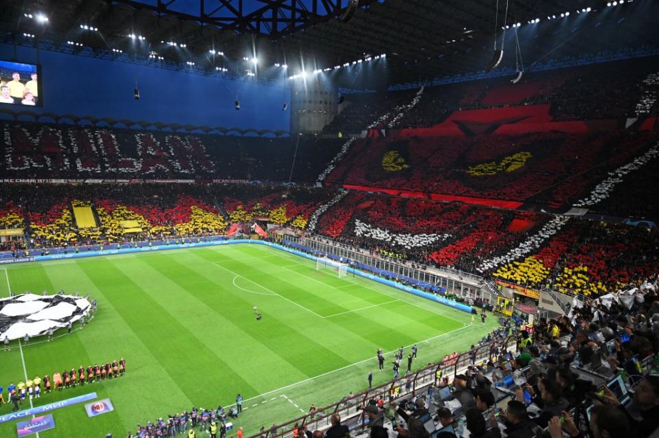 Fans of AC Milan choreograph visual displays in the stands ahead of the match during the UEFA Champions League semi-final match between AC Milan and FC Internazionale at San Siro on May 10, 2023.