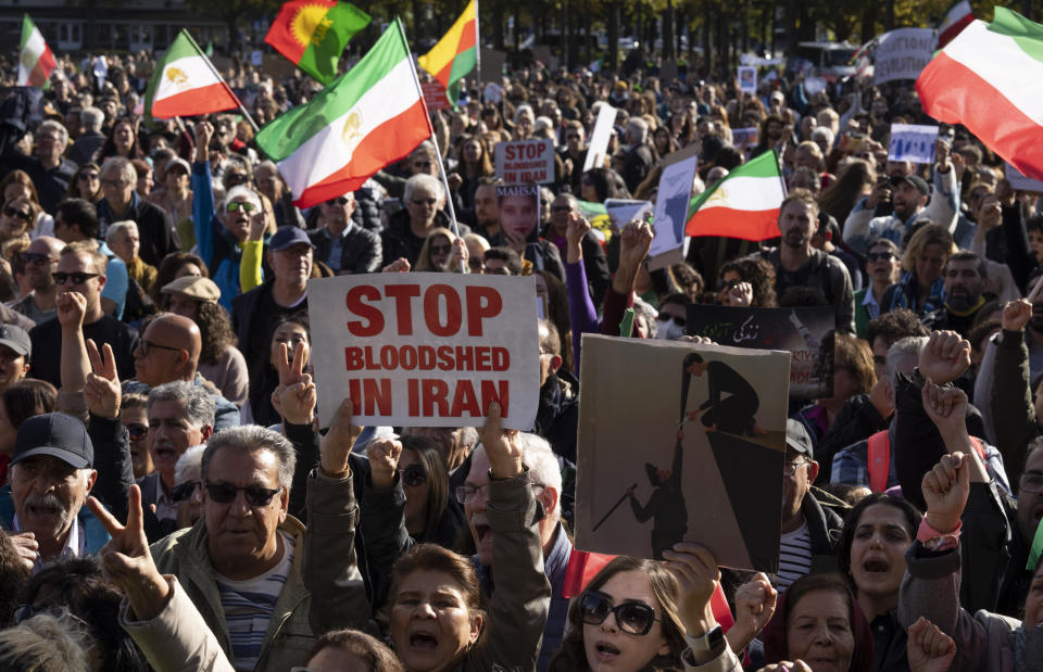 FILE - Thousands showed their support for Iranian protesters standing up to their leadership over the death of a young woman in police custody, during a demonstration in The Hague, Netherlands, Saturday, Oct. 8, 2022. As anti-government protests roil cities and towns in Iran for a fourth week, sparked by the death of a 22-year-old woman detained by Iran's morality police, tens of thousands of Iranians living abroad have marched on the streets of Europe, North America and beyond in support of what many believe to be a watershed moment for their home country. (AP Photo/Peter Dejong, File)