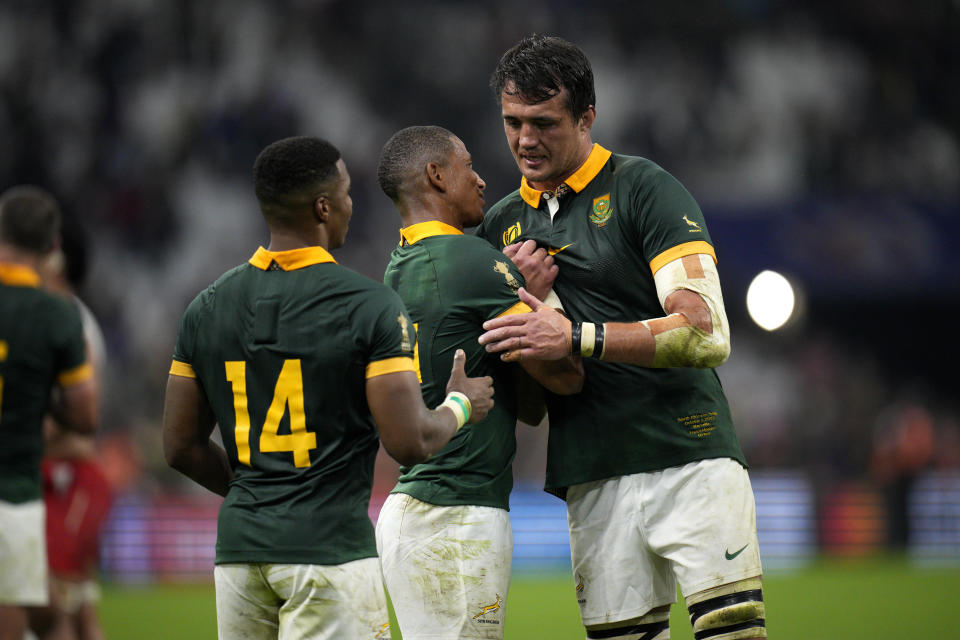 South Africa's Franco Mostert, right, shakes hands with his teammates Manie Libbo, centre, and Grant Williams at the end of Rugby World Cup Pool B match between South Africa and Tonga at the Marseille's Stade Velodrome, in Marseille, France Sunday, Oct. 1, 2023. (AP Photo/Daniel Cole)