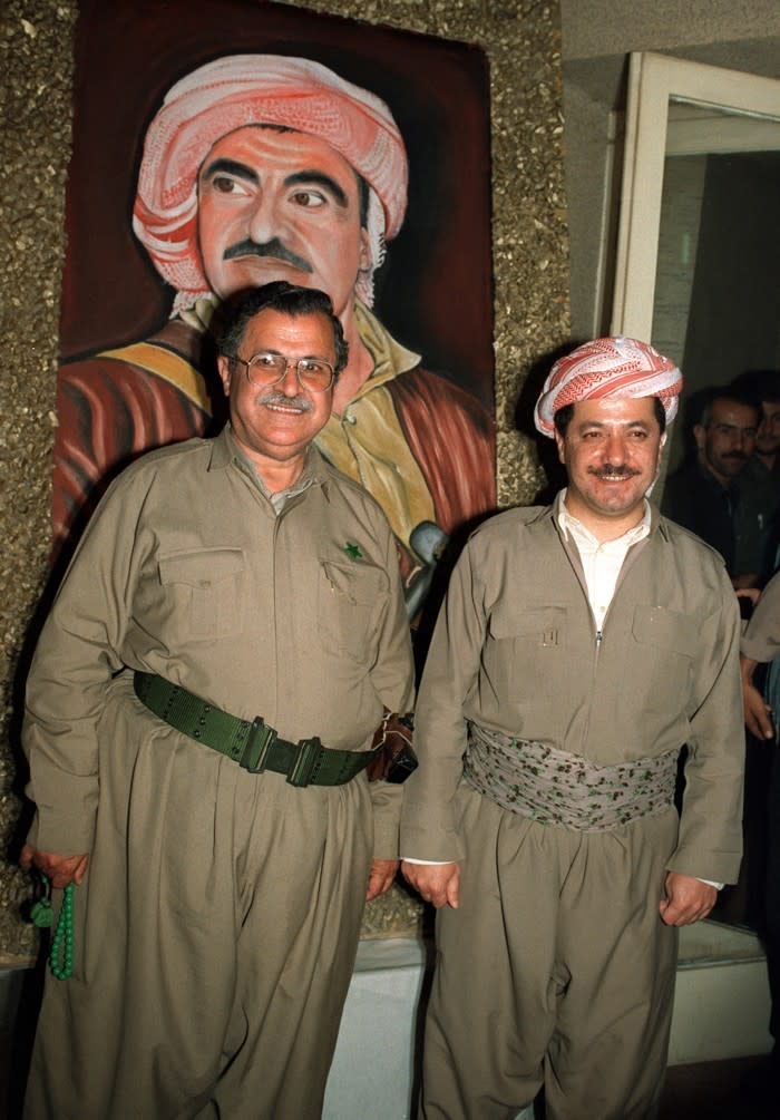 Massud Barzani and Jalal Talabani pose in front of the painting of Mustafa Barzani (Rabih Moghrabi / Getty)