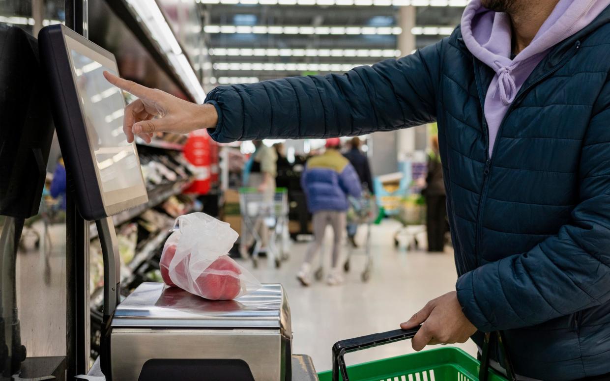 Side view of a man shopping in a supermarket