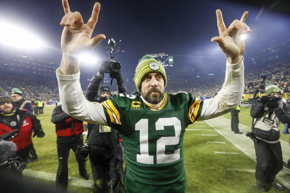 Green Bay Packers' Aaron Rodgers celebrates as he walks off the field after an NFL divisional playoff football game against the Seattle Seahawks Sunday, Jan. 12, 2020, in Green Bay, Wis. The Packers won 28-23 to advance to the NFC Championship. (AP Photo/Mike Roemer)