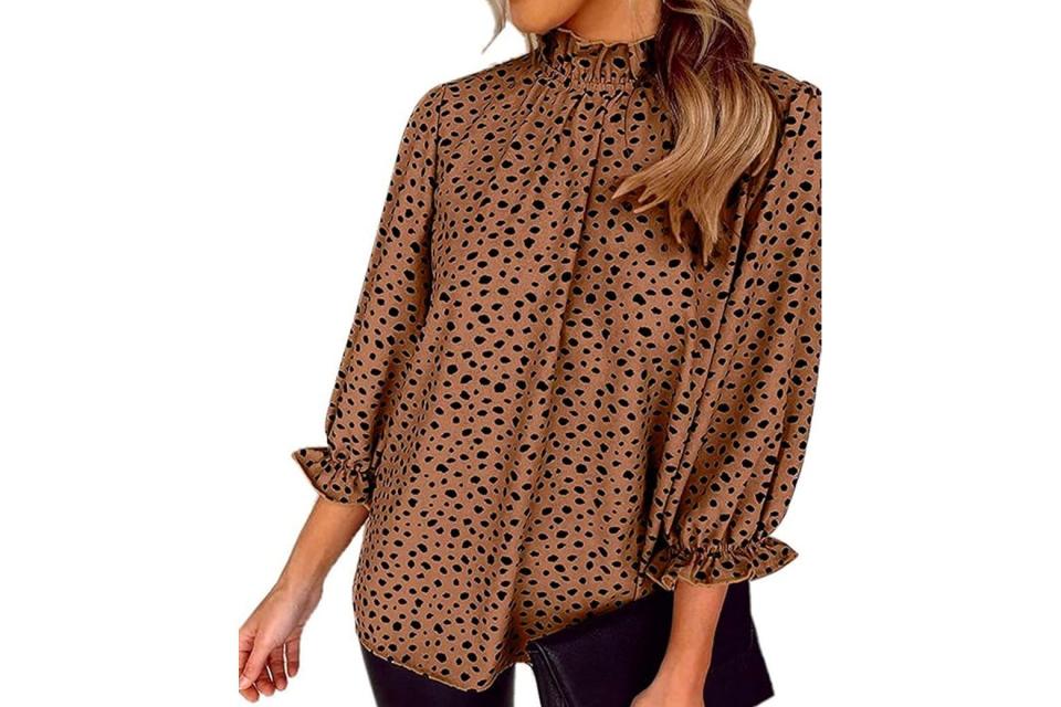 A cheetah-print blouse on a model.