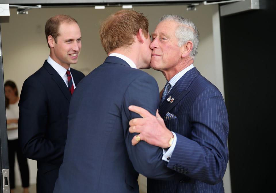 london, england september 10 prince charles, prince of wales kisses his son prince harry as prince william, duke of cambridge looks on ahead of the invictus games opening ceremony at queen elizabeth ii park on september 10, 2014 in london, england the international sports event for wounded warriors, presented by jaguar land rover, is just days away with limited last minute tickets available at wwwinvictusgamesorg photo by chris jacksongetty images