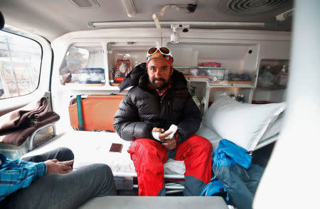 Indian climber Ratnesh Panday, who says he successfully climbed Mount Everest, sits with frostbitten fingers inside the ambulance after being rescued from Mount Everest in Kathmandu, Nepal, May 24, 2016. REUTERS/Navesh Chitrakar