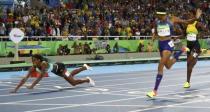 2016 Rio Olympics - Athletics - Final - Women's 400m Final - Olympic Stadium - Rio de Janeiro, Brazil - 15/08/2016. Shaunae Miller (BAH) of Bahamas throws herself across the finish line to win the gold medal. REUTERS/Kai Pfaffenbach