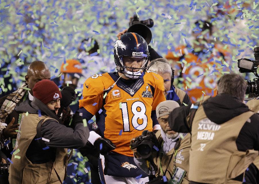 FILE - In this Feb. 2, 2014 file photo, Denver Broncos quarterback Peyton Manning walks off the field after the Broncos lost to the Seattle Seahawks in the NFL Super Bowl XLVIII football game in East Rutherford, N.J. Manning delivers the keynote address at the Boy Scouts of America's annual breakfast Wednesday, April 16, 2014 in Denver, and makes his first public comments since the Broncos were trounced by Seattle from the opening snap of the Super Bowl. (AP Photo/Chris O'Meara, File)