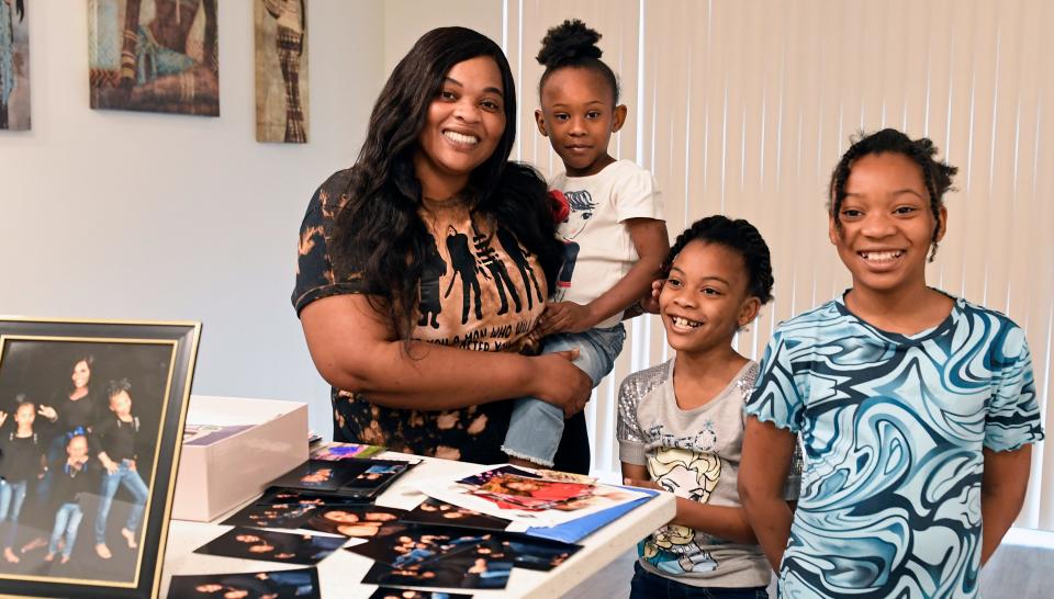 Katie Dore with her daughters, Elaya, 4, McKayla, 8, and Ta'Nyia, 10 at their new apartment in Lofts on Lemon in downtown Sarasota.